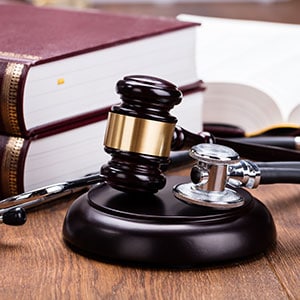 Stethoscope with judge gavel - Leep Tescher Helfman and Zanze