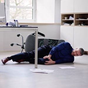 The image shows an employee falling from a broken chair and getting injured. - Leep Tescher Helfman and Zanze